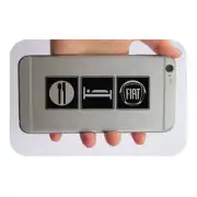Three eat, sleep and FIAT symbols placed on the back of a mobile phone