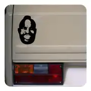 Black bearded face applied to the rear bodywork of a vehicle