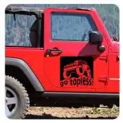 Go Topless sticker applied to the door of a red Jeep Wrangler