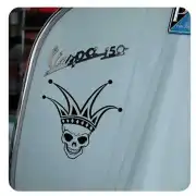 Crowned skull applied to the side window of a vehicle