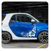 White Hibiscus sticker applied to the door of a blue car