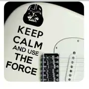 Adhesive with black helmet and «KEEP CALM AND USE THE FORCE» text applied next to a guitar